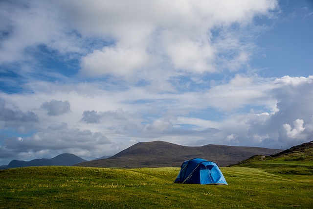 outdoor classroom style learning with camping gear laid out including stove water filter and tent components